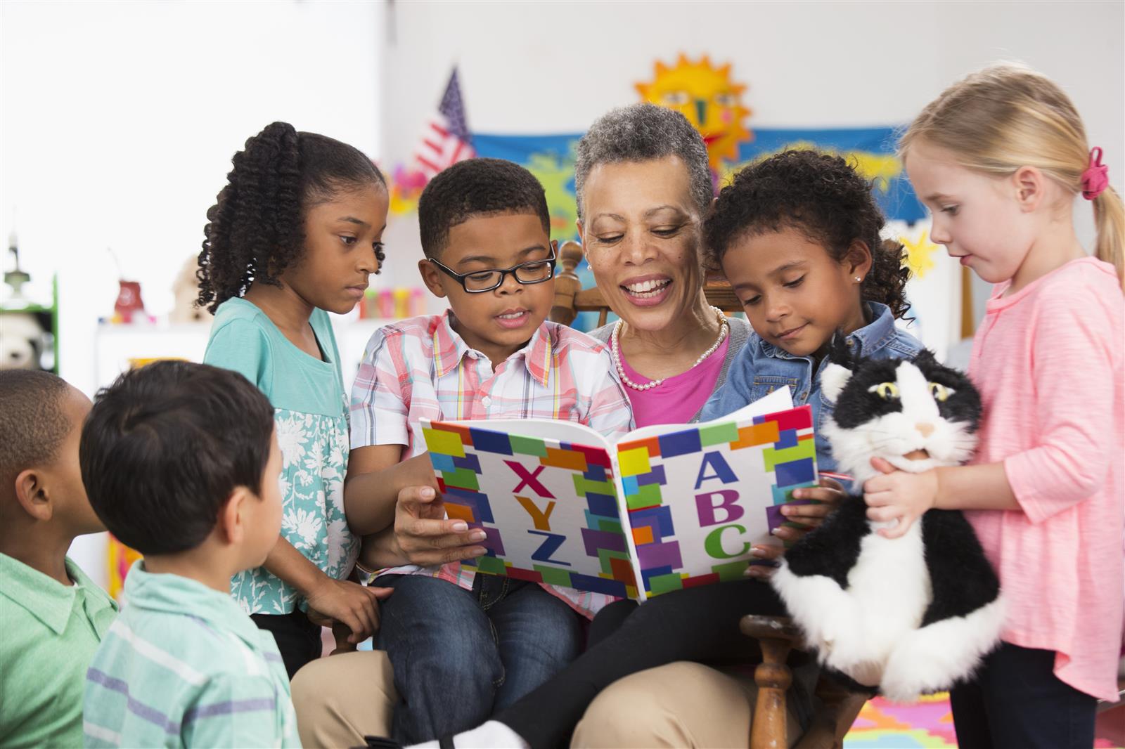  A teacher reading to elementary-age students